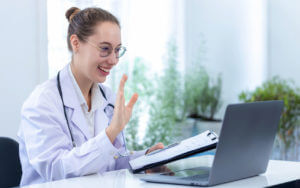 concierge medicine doctor making online call using Laptop